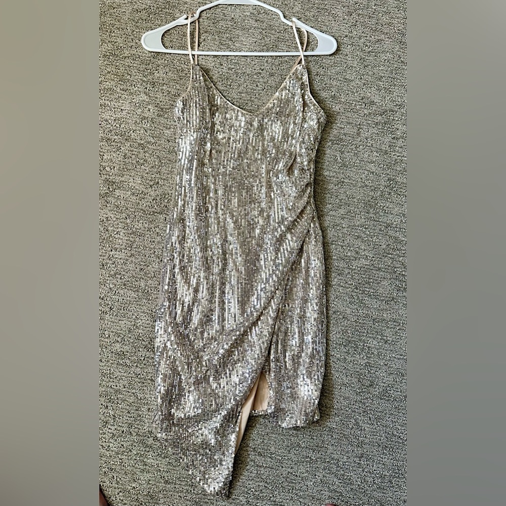 Silver glam dress. Spaghetti strap with slit on the front.